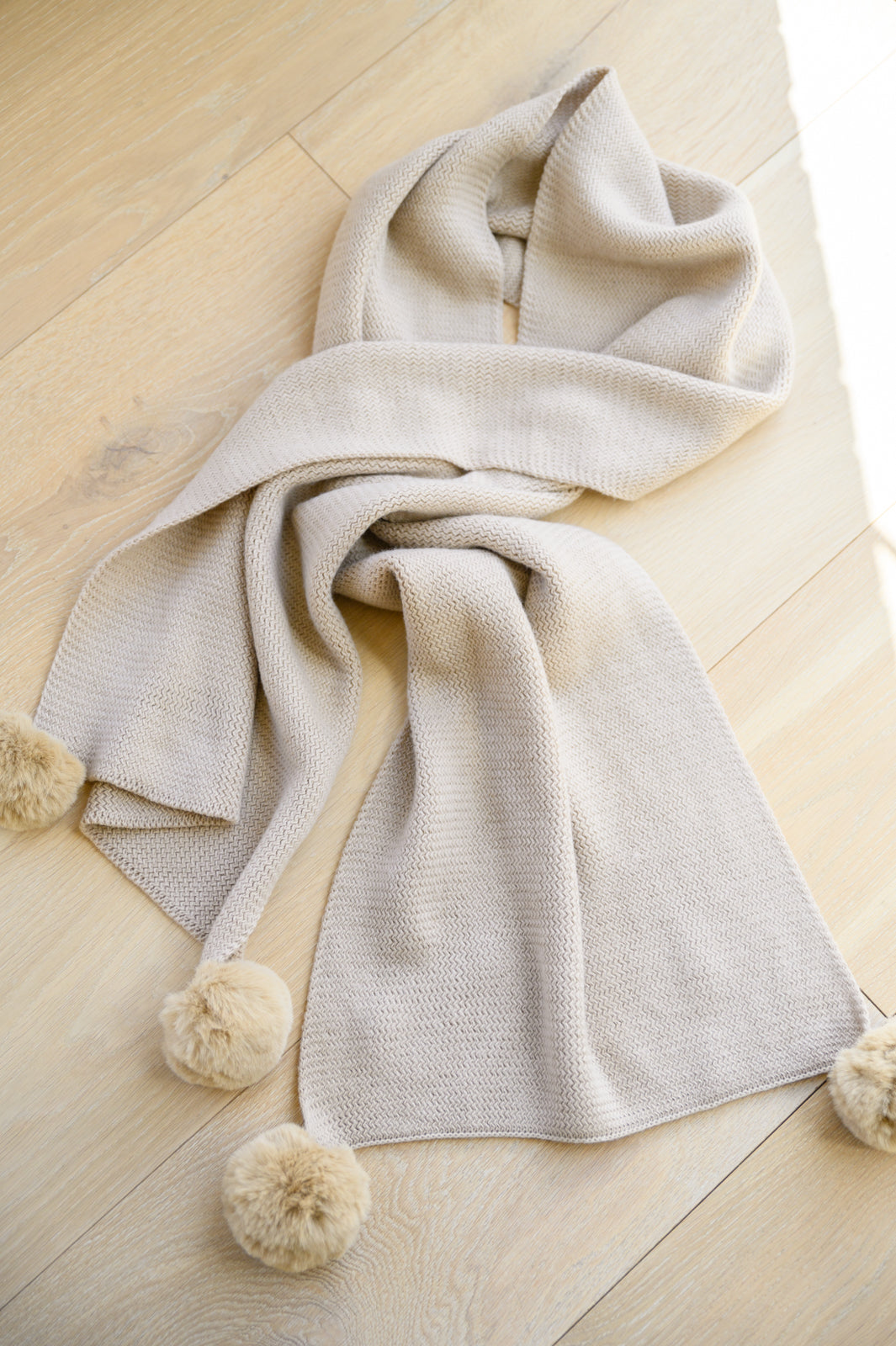 KnittedFuzzyPomPomScarfInBeige4